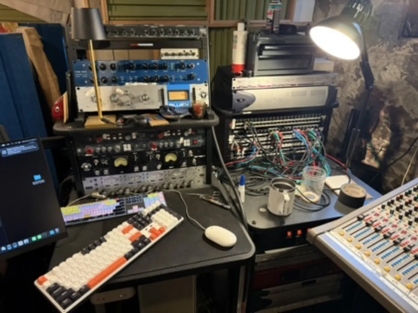 Studio workbench with rack gear, patch cords and console