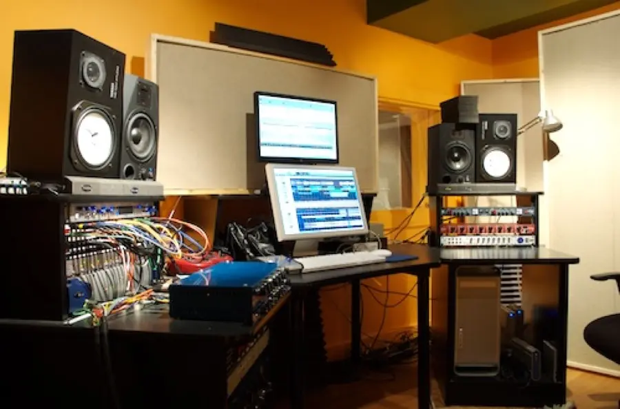 Control room with racks, patchbays and monitors